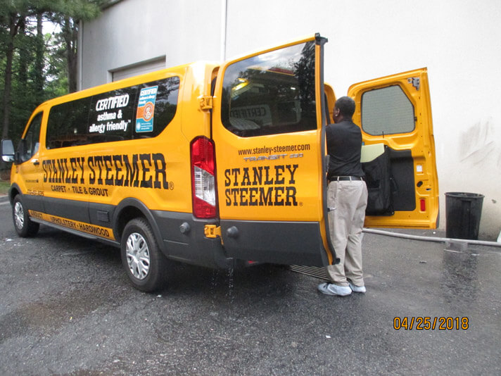 Atlanta Ga Cleaning Services Stanley Steemer Atlanta Georgia Crew Member Standing Outside Of A Carpet Cleaning Service Van