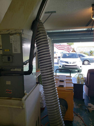 Delray Beach Fl Cleaning Services Stanley Steemer Delray Beach Florida Crew Cleaning An Air Duct In The Garage Of A Customer S Home