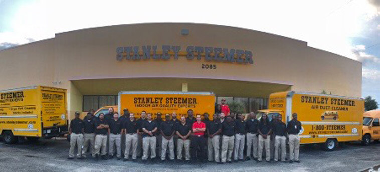 Delray Beach Fl Cleaning Services Stanley Steemer Delray Beach Florida Crew Standing In Front Of Service Vans Their Office Parking Lot